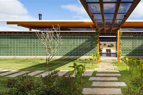Breeze-Block Walls Add to the Airy Atmosphere of a Lakefront Home in Brazil